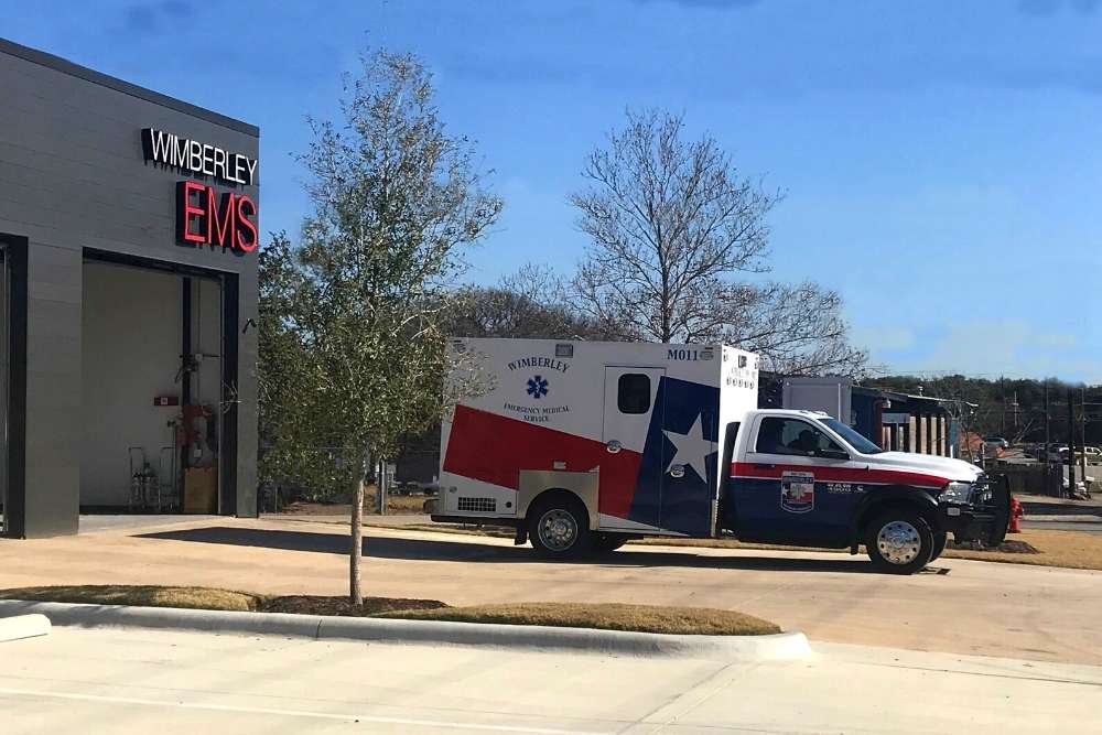 Ambulance in front of fire station building in Wimberley, Texas